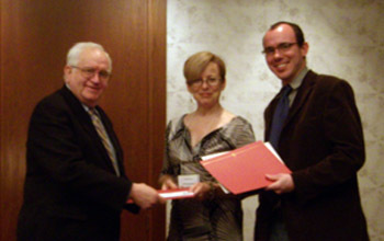 Julia Douthwaite and Daniel Richter, receiving their award from UCLA professor Frederick Burwick