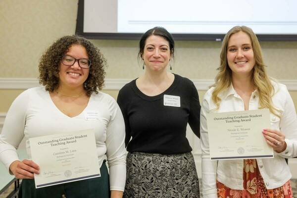 Dr. Rebecca A. Wingert, director of graduate studies for the Department of Biological Sciences, celebrates doctoral students and winners of the Outstanding Graduate Student Teaching Award, Caroline Lara (L) and Nicole Weaver (R).