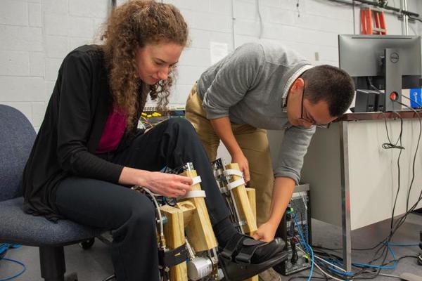 Anne Martin, '14 Ph.D., works to optimize exoskeleton support for walking assistance.