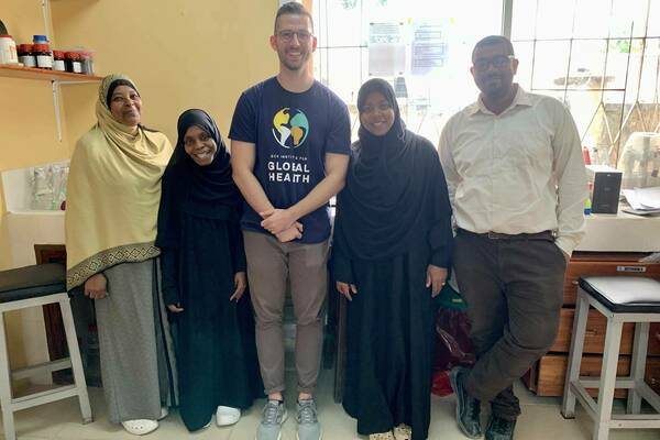 Holzschuh in the lab in Zanzibar with four lab technicians from the Zanzibar Malaria Elimination Programme