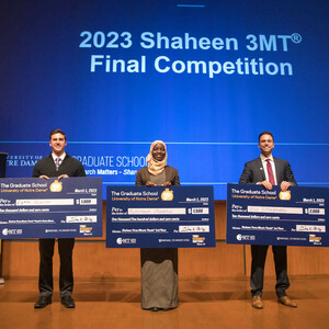 Left to right: Isaac Angera, voted People's Choice winner; Mariama S. Dampha, second-place winner; and Alex Boomgarden, first-place winner of the 2023 Shaheen 3MT Competition (3MT®).