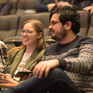 Audience members enjoy the presentations at the 2023 3MT finals.