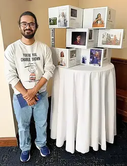 Smiling man with glasses and beard in a